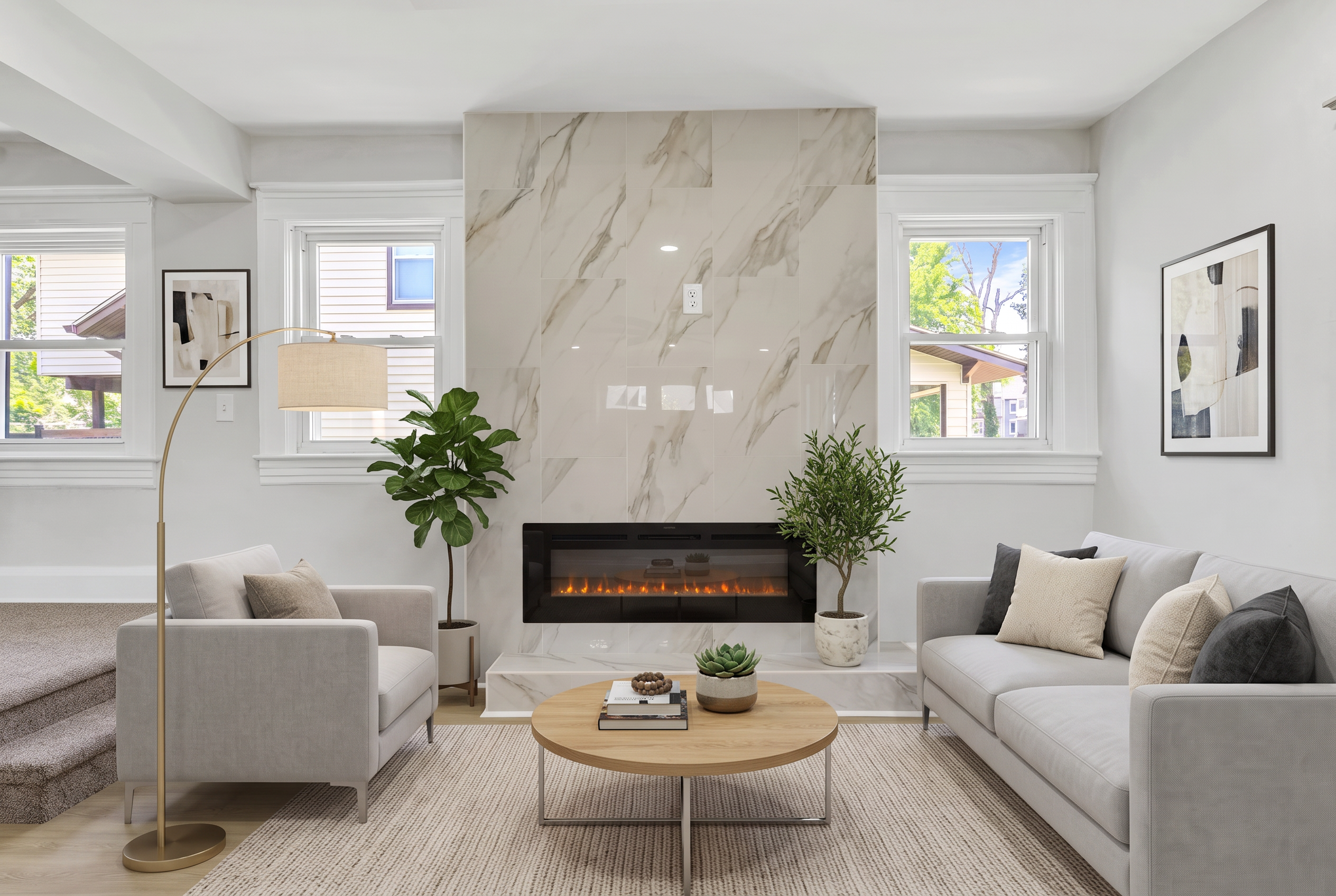 The same living room after virtual staging with sofa, rug and art